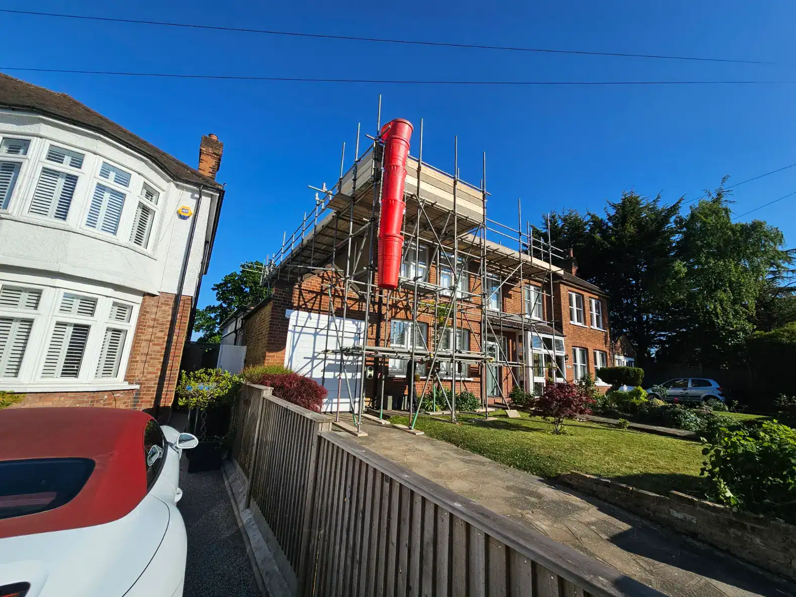 Indeoendent-with-loading-bay-with-rubbish-chute-for-roofing-works-London