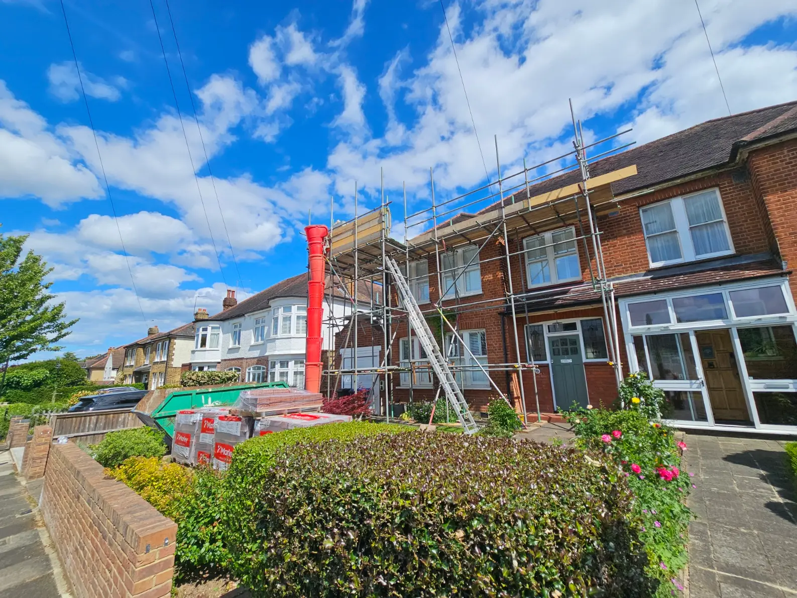 independent-scaffold-with-loading-bay-and-rubbish-chute-for-rofing-works